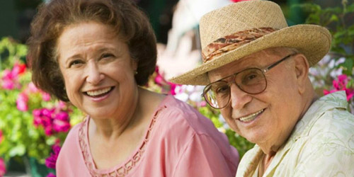 Smiling Seniors with flowers