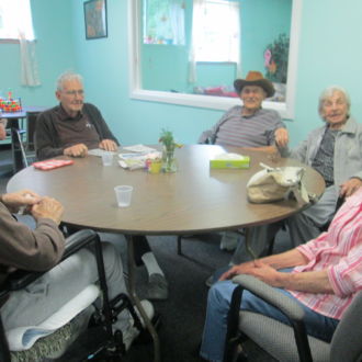 Groupn of seniors sitting at the table