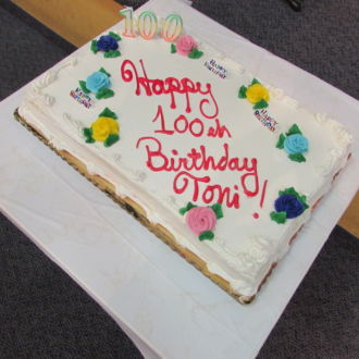 Cake with writings Happy 100 Birthday, Toni!