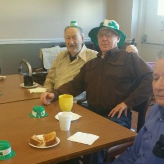 Group of seniors wearing St. Patric hats
