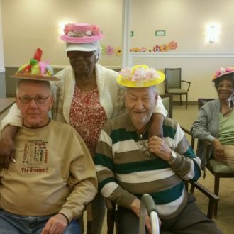 Group of seniors wearing decorated hats